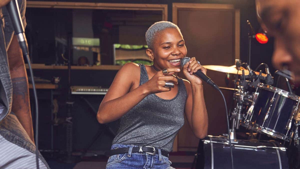 image of person singing on stage to illustrate MasterCard web3 music initiative 