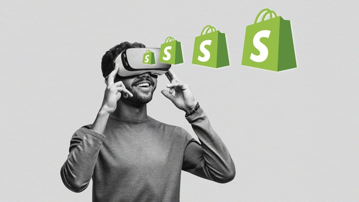 A man wears a VR headset in support of Shopify NFTs.