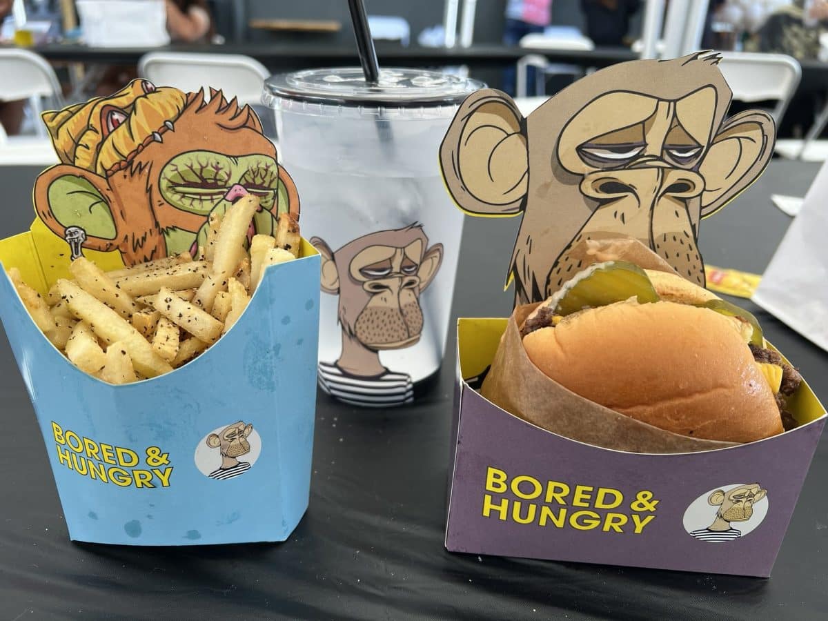 image of a burger with fries and a drink from the Bored and Hungry restaurant