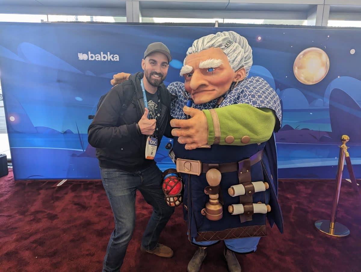 A man stands with the influencer Babka at GDC 2023.